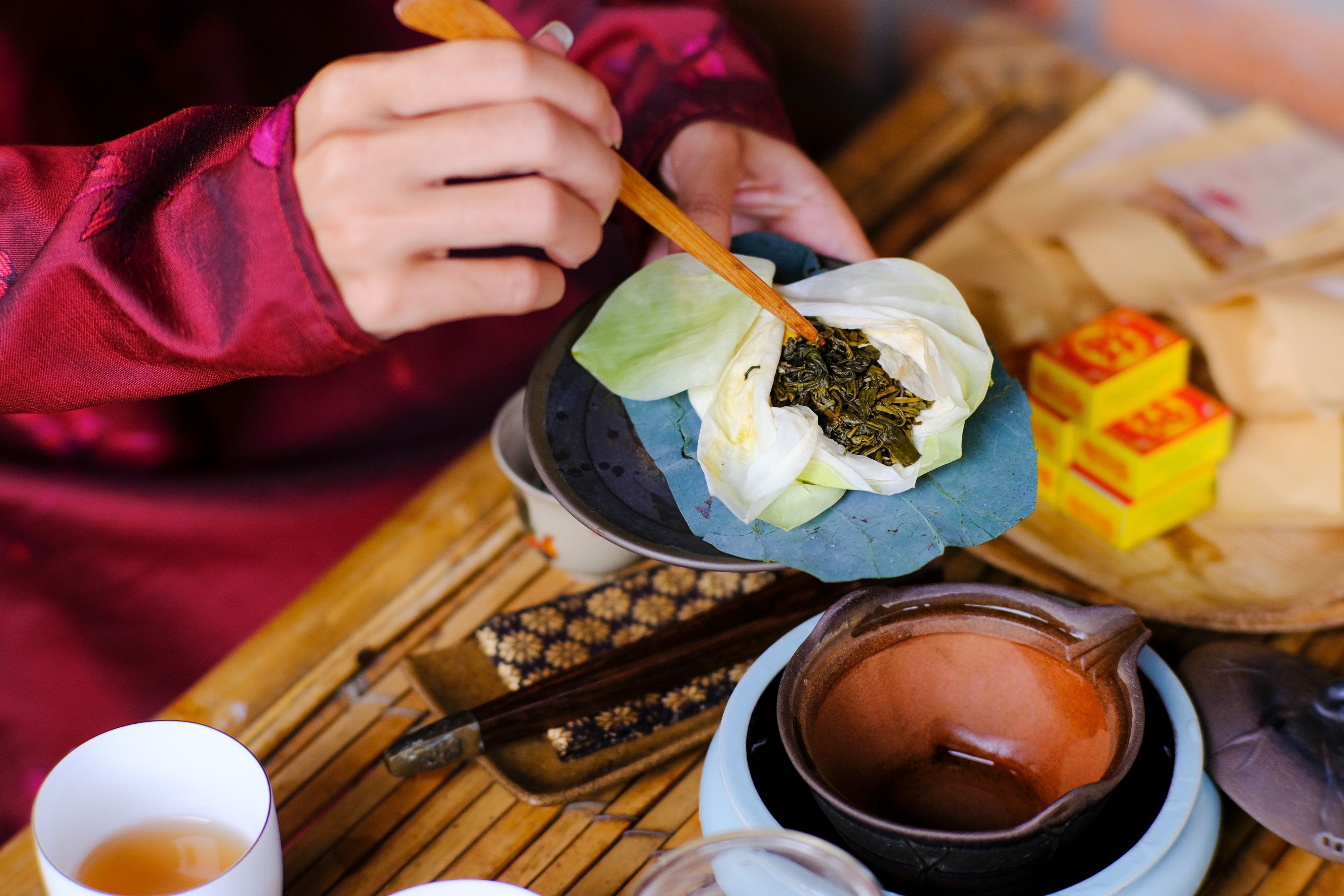 This is an image of someone brewing lotus tea